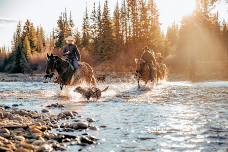 Riders cross the creek